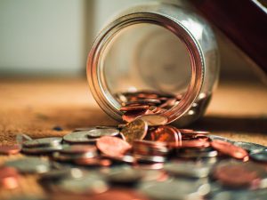 coins pouring out from a bottle